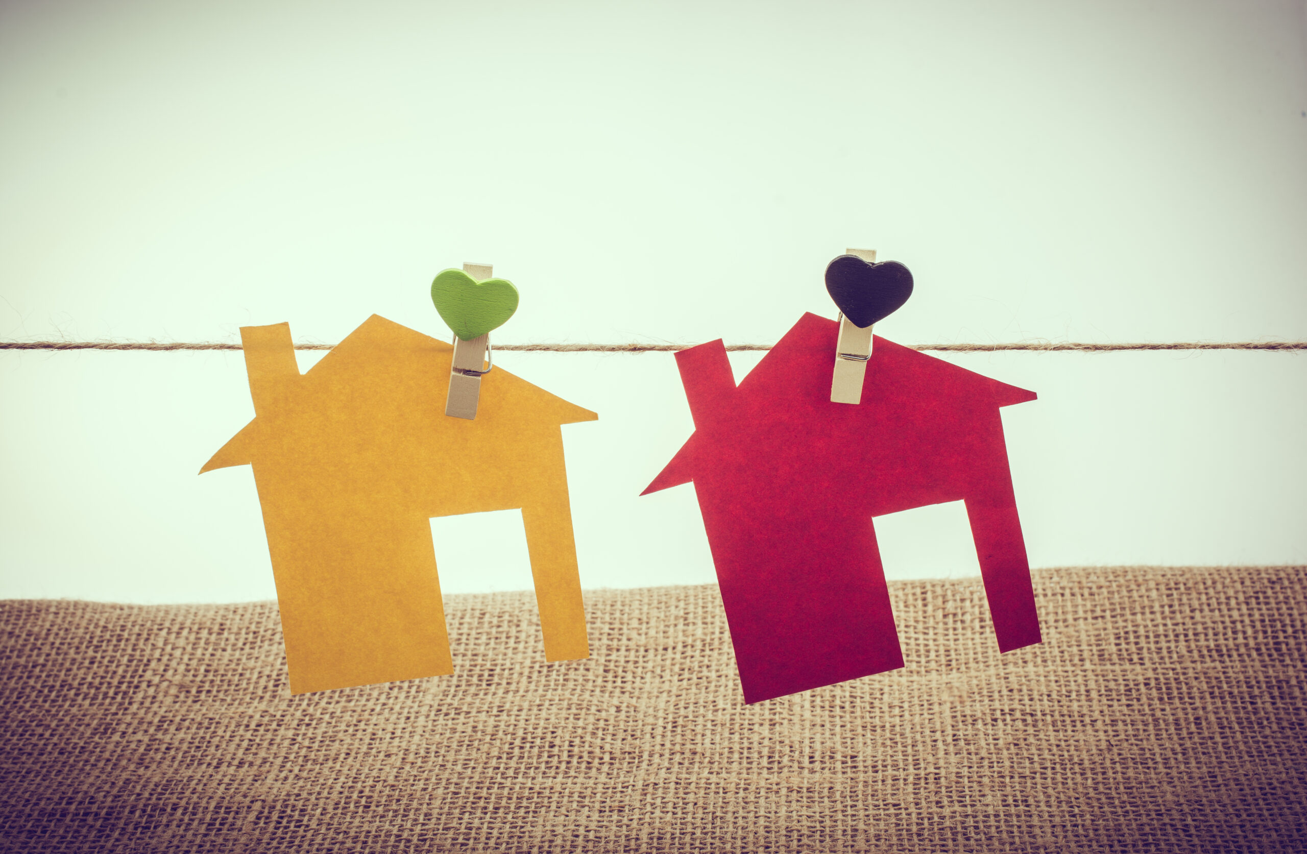 Little colorful paper houses attached on a string